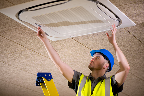 Man installing air conditioner